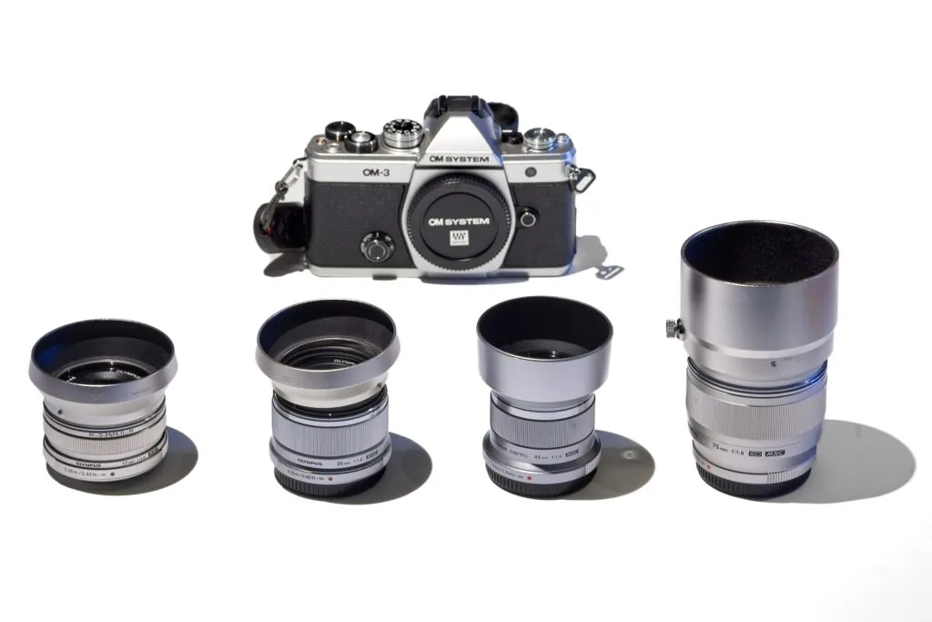 Best lenses for the new OM-3 camera Home The best lenses for the OM-3 — four classic Olympus silver f1.8 primes: 17mm, 25mm, 45mm, and 75mm
