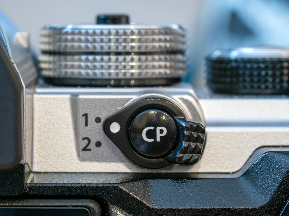 OM-3 CP (Computational Photography) button on camera body